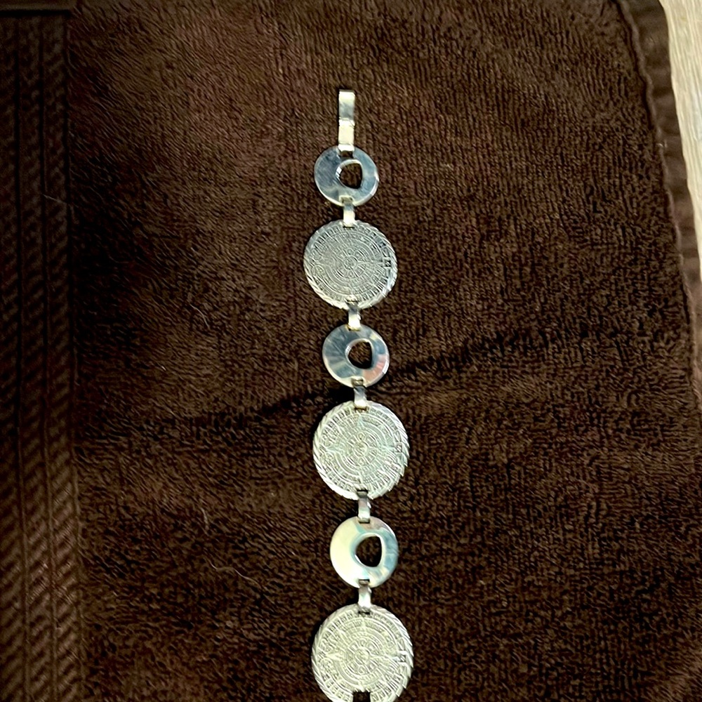 8 inch stamped silver sun dial silver bracelet